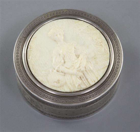 A late 19th/early 20th French silver and ivory circular snuff box, 78mm.
